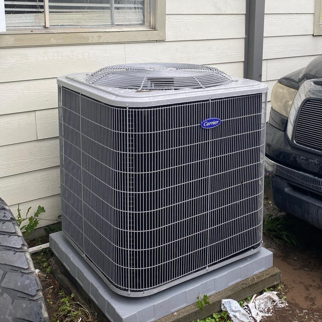 Professional HVAC contractor from Global Air Service servicing rooftop AC unit