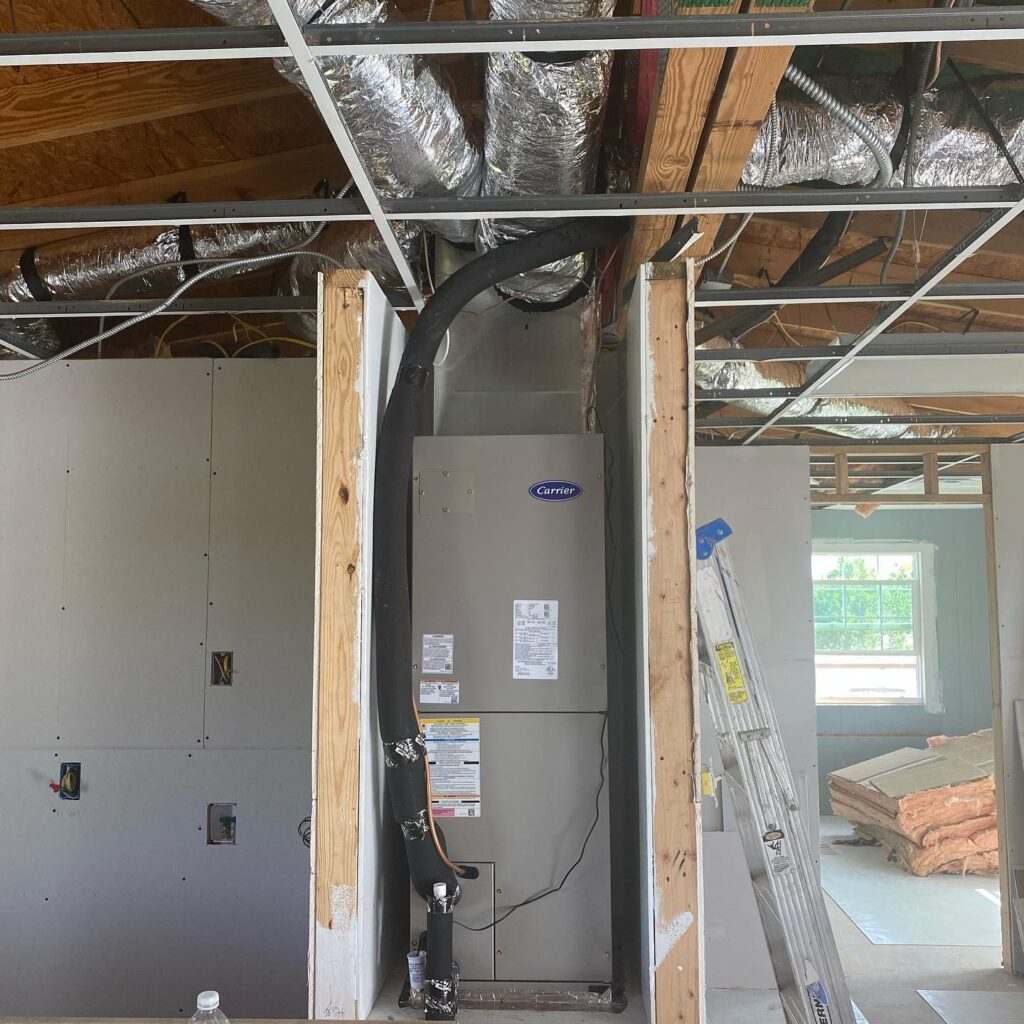 Professional HVAC contractor from Global Air Service servicing rooftop AC unit