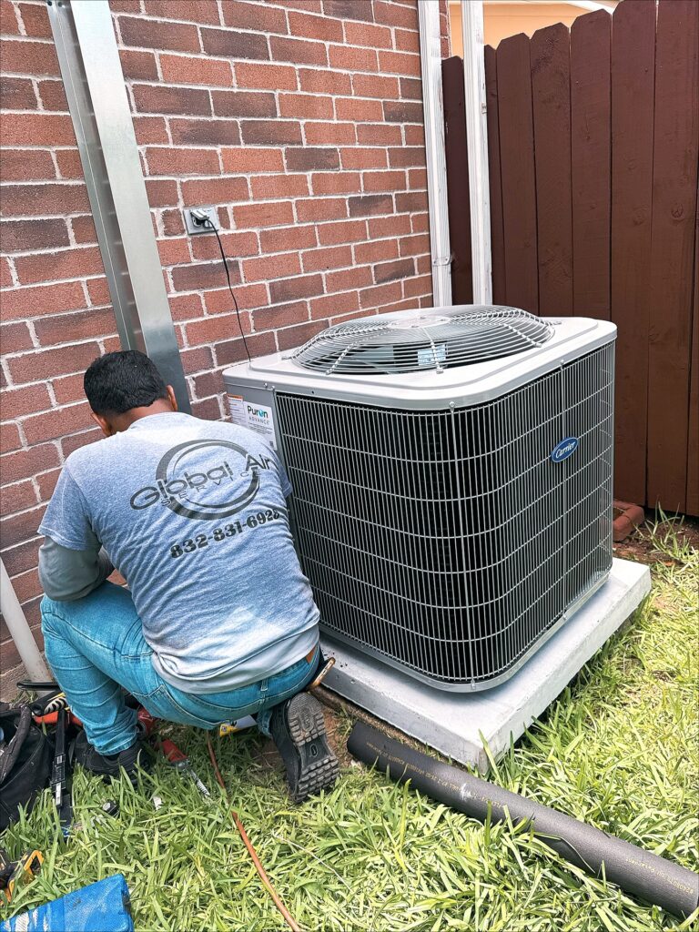 Global Air Service technician servicing HVAC unit, professional maintenance setup